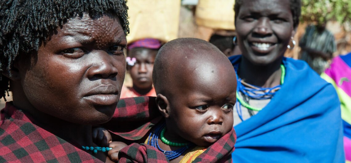 Which languages do Ugandans speak